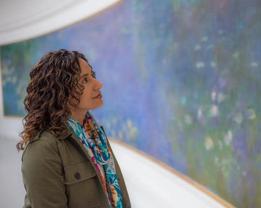 girl looking at Monet's waterlilies painting 