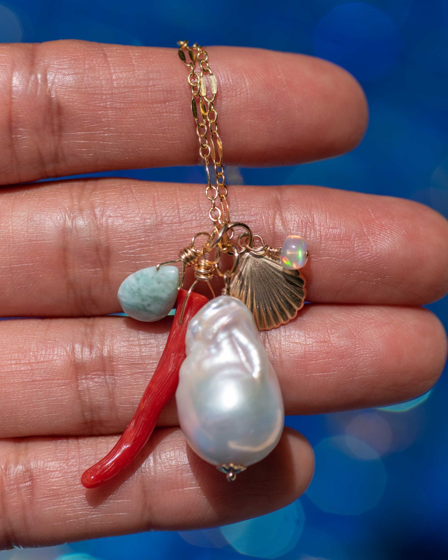large baroque pearl with coral and seashell charm