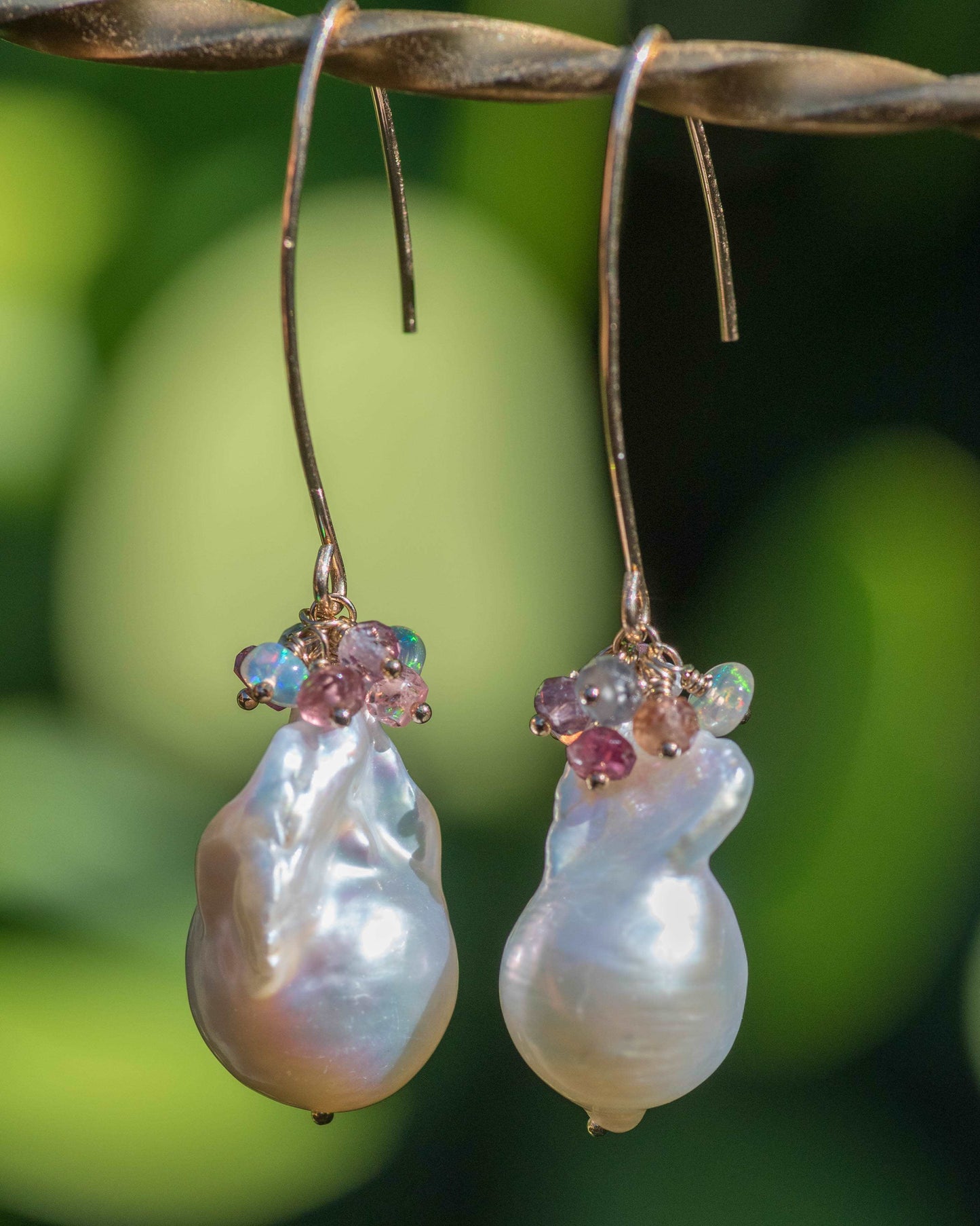 baroque pearl earrings with gemstone cluster in gold